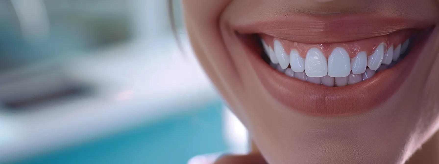 a person with a radiant smile admiring their new veneers in a modern dental office.