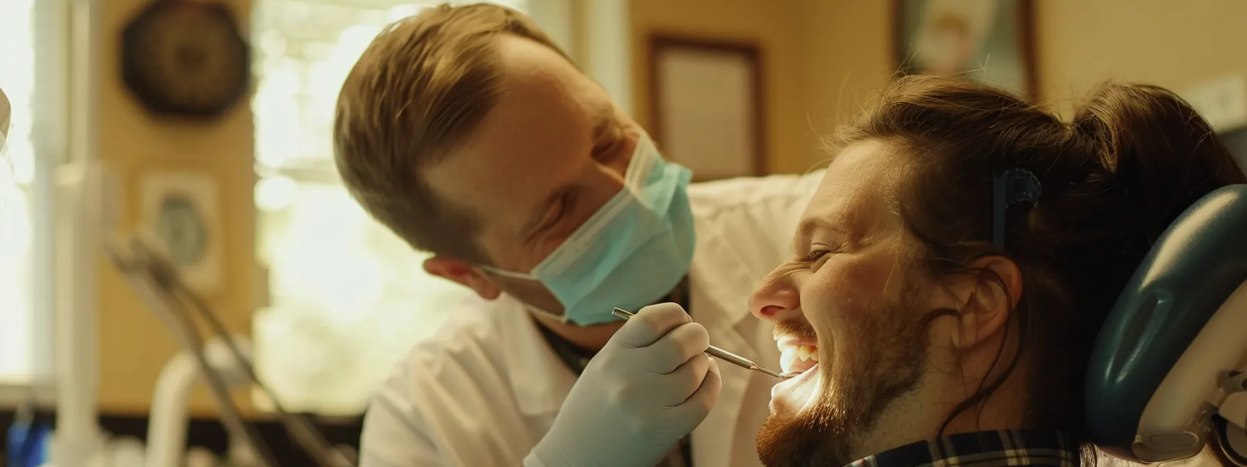 a local dentist in northland kc carefully examining a patient's smile.